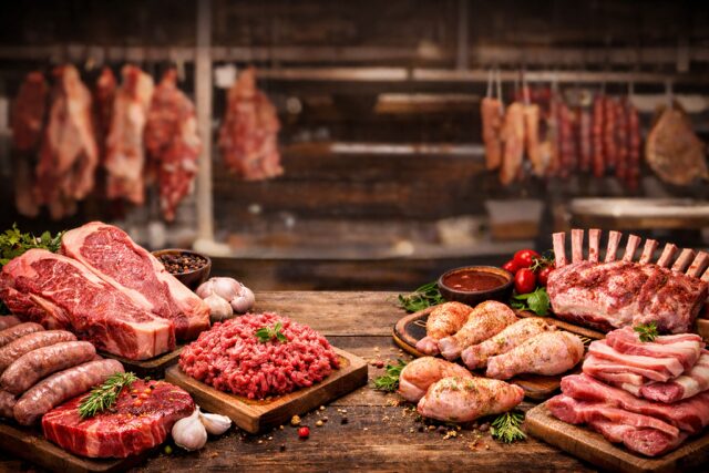 Fresh cuts of meat on a butcher's counter